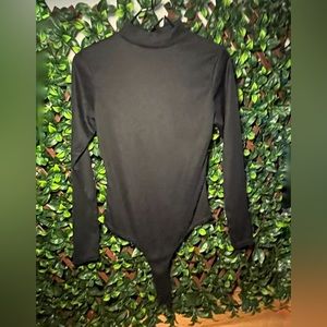 Brand new turtleneck bodysuit with tags, size s.